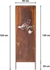 A tall, rectangular metal screen with a rust-like finish, featuring a cut-out design of a tree branch with birds and a birdcage. Dimensions are indicated by measurement lines and text. Voir les images du produit