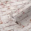 A roll of wallpaper with a brick pattern. Produktbild-Vorschau