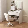 A white vanity table with a mirror and chair, set up in a room with a curtain and wooden floor. Produktbild-Vorschau