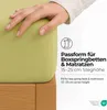 A hand is shown touching a light green fitted sheet on a wooden bed frame. Text and icons are overlaid on the right side of the image. Produktbild-Vorschau