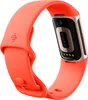 A coral Fitbit Charge 6 with a champagne gold accent, shown from the back with the sensors visible. Náhled obrázku produktu