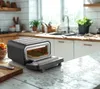 Pizzaofen elektrisch Seitenansicht kompakt – 1700W Steinofen für die Küche schwarz – BOLKANI Produktbild-Vorschau