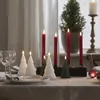 A table setting with Christmas-themed candles and glassware. Produktbild-Vorschau