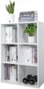 A white cube shelf unit filled with books and plants. Voir les images du produit