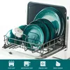 A dishwasher rack filled with teal and white patterned plates and bowls. Produktbild-Vorschau