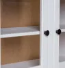 A close-up view of a white cabinet with two black knobs and visible shelves. Náhľad obrázku produktu