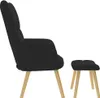 A black fabric armchair and ottoman are shown from the side against a white background. Anteprima dell’immagine prodotto