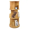 A three-tiered rotating bookshelf with books, a teddy bear, and a clock on it. Produktbild-Vorschau
