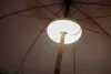 Close-up view of the underside of a patio umbrella with a built-in LED light. Produktbild-Vorschau
