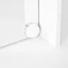 A close-up of a white vanity table corner with a round light bulb attached. Podgląd zdjęcia produktu