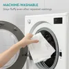 A hand is holding a white microfiber cloth in front of an open washing machine. Produktbild-Vorschau