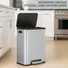 A stainless steel pedal bin with its lid open, placed in a modern kitchen setting. Podgląd zdjęcia produktu