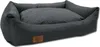 A dark gray dog bed with a quilted inner cushion and a brown leather logo patch on the front. Anteprima dell’immagine prodotto