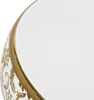 A close-up view of the edge of a white ceramic sink with a gold decorative pattern. Náhled obrázku produktu
