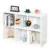 A white modular shelf unit filled with various decorative items and books. Náhled obrázku produktu