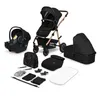 A collection of baby travel gear, including a stroller, car seat, bassinet, and accessories, laid out on a white background. Produktbild-Vorschau