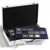 An open silver briefcase containing coin trays with coins. Produktbild-Vorschau