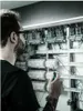 An electrician working on a control panel. Produktbild-Vorschau