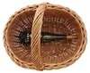 A top-down view of a wicker basket containing a bottle of white wine. Produktbild-Vorschau