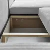Close-up view of the interior structure of a sofa, showing the wooden frame and storage compartment. Produktbild-Vorschau