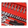 A close-up view of a red toolbox containing various metal tools, including sockets and a ratchet wrench. Produktbild-Vorschau