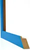 A corner piece of a blue picture frame, showing the profile and the raw MDF material on the inside. Produktbild-Vorschau
