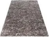 A shaggy rug is shown from a slightly elevated angle on a white background. Podgląd zdjęcia produktu