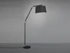A modern black floor lamp with a gold accent and a black fabric lampshade is shown against a plain gray background. Náhled obrázku produktu