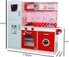 A wooden toy kitchen with a refrigerator, oven, microwave, and sink. Produktbild-Vorschau