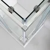 Close-up view of the corner of a shower cabin, showing the glass panels and metal frame. Anteprima dell’immagine prodotto