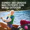A woman is rowing a canoe on a lake, with camping gear and a pink Bluetooth speaker in the boat. Produktbild-Vorschau
