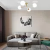 A modern living room with a sofa, coffee table, and artwork. Produktbild-Vorschau