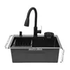 A black kitchen sink with a faucet and accessories, shown against a white background with measurement indicators. Podgląd zdjęcia produktu