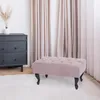 A tufted ottoman sits on a white rug in front of beige curtains and a dark gray dresser. Anteprima dell’immagine prodotto