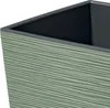A close-up view of the textured side of a green planter. Produktbild-Vorschau
