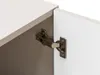 A close-up view of a cabinet hinge connecting a cabinet door to the cabinet frame. Náhled obrázku produktu