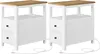 Two identical white nightstands with wooden tops and two drawers each, shown from the front-left angle. Power cords are visible extending from the back of each nightstand. Náhled obrázku produktu