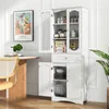 A white freestanding cabinet with glass doors and a drawer, filled with kitchenware and food items, is shown in a room with a wooden table and chair. Anteprima dell’immagine prodotto
