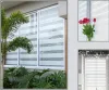A collage of images showing blinds in different settings, including a window with plants, a close-up of tulips, and a decorated window. Produktbild-Vorschau