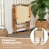 A folded camping chair is shown leaning against a white railing, with a plant in a woven pot to the right. Text overlays describe the product. Produktbild-Vorschau