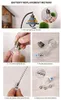 Instructions for replacing batteries in a small light bulb ornament. Produktbild-Vorschau