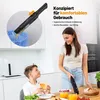 A woman is holding a hand vacuum cleaner in a kitchen setting, while a boy sits at a table. Náhled obrázku produktu