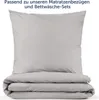 A folded duvet and a pillow, both in light gray fabric, are displayed against a white background. Anteprima dell’immagine prodotto