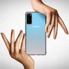 Two hands are holding a Samsung smartphone with a light blue and white gradient back. Produktbild-Vorschau