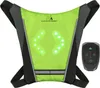 A bright green safety vest with LED directional arrows and a remote control. Náhľad obrázku produktu