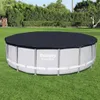 An above-ground swimming pool with a dark cover, set up on a grassy lawn. Produktbild-Vorschau