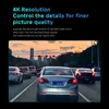 Cars driving on a road at dusk with city buildings in the background. Produktbild-Vorschau