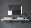 A modern bathroom vanity with two sinks and a large illuminated mirror. Produktbild-Vorschau