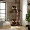 A cat tree is set up in a bedroom next to a bed and a window. Produktbild-Vorschau