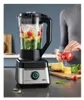 A person is adding strawberries to a blender filled with fruits and greens. Produktbild-Vorschau